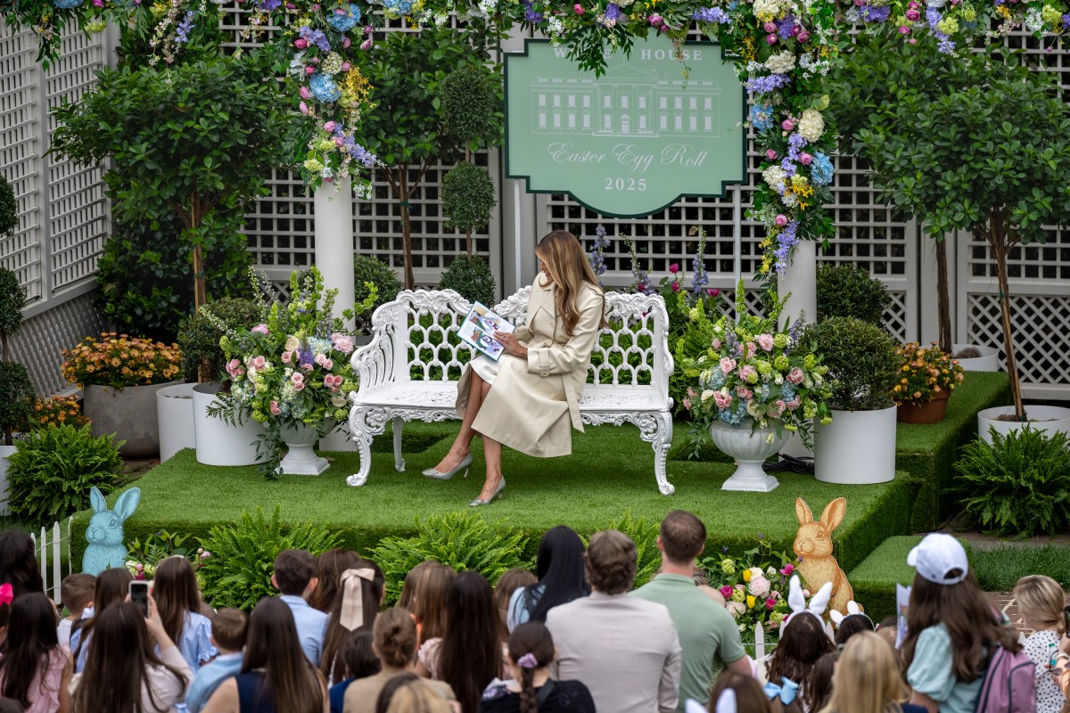 First Lady Melania Trump reads a book at the Reading Nook in the First Ladies Garden during the White House Easter Egg Roll, Monday, April 21, 2025, on the South Lawn.(Official White House Photo by Carlos Fyfe)